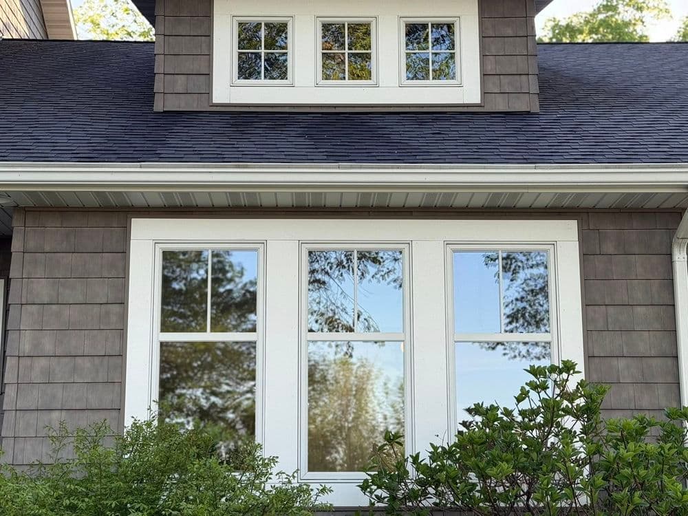 Modern home exterior featuring large windows and contemporary architecture.